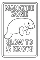 Gentle Manatee Swims By the Sign